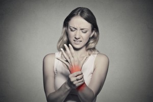 woman in pain from her rheumatoid arthritis
