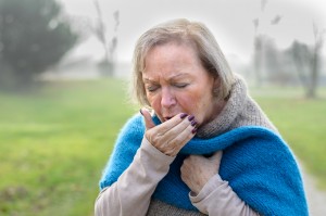 Elderly woman coughing as sign of heart failure